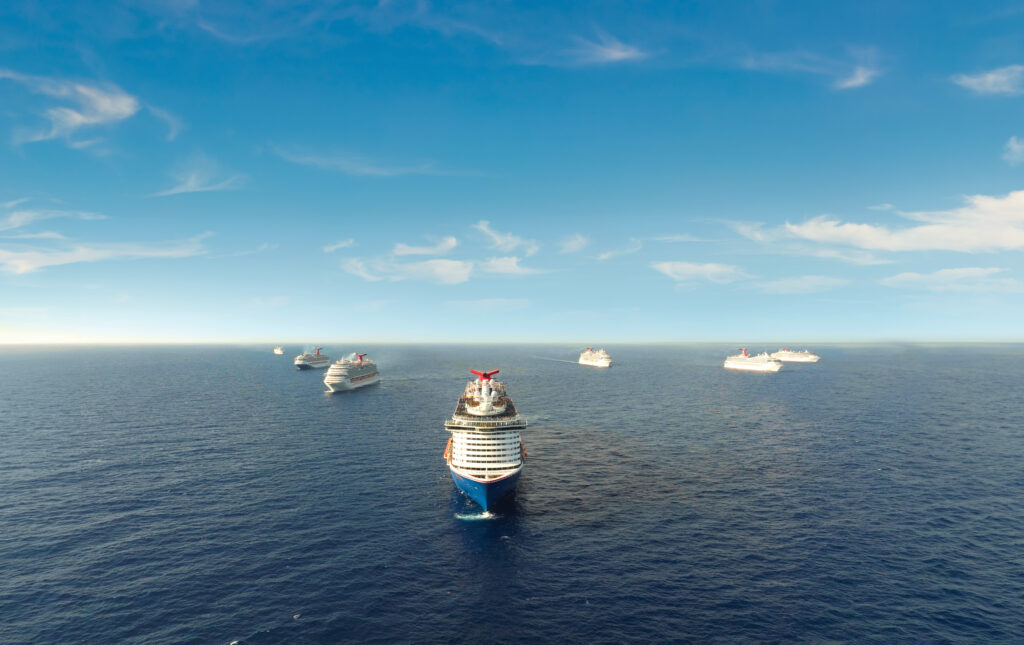 A unique gathering of seven Carnival Cruise Line ships meeting at sea.